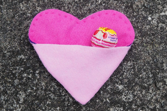 a handsewn Heart Purse for Valentines Day with a sweet in the pocket.