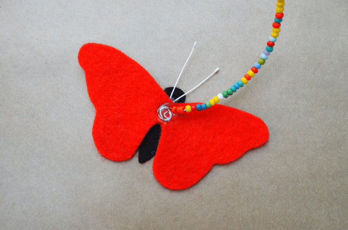 glueing wire to the DIY butterfly mobile