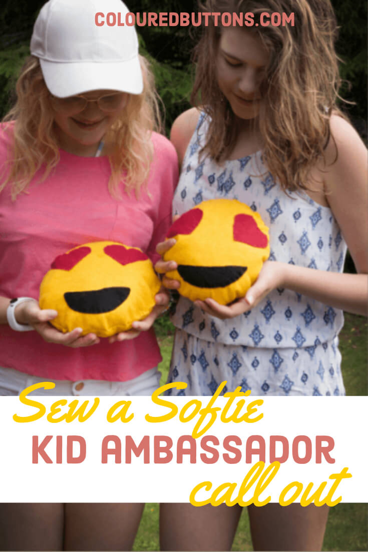 two girls holding softies they have sewn as part of Sew a Softie in July