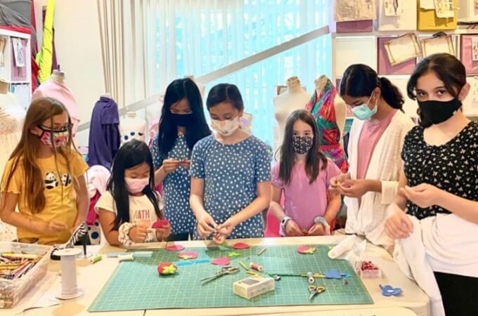 kids learning to sew